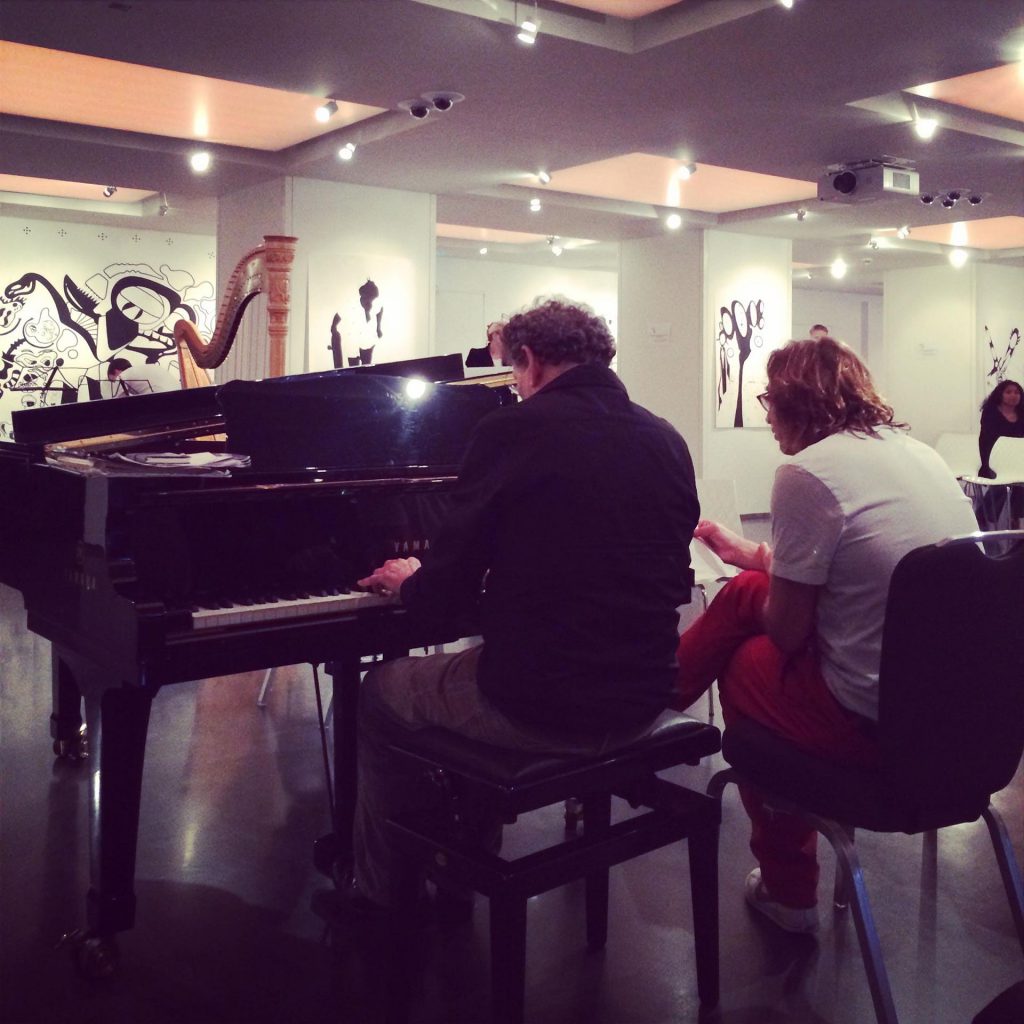 Mike Garry and Philip Glass at the piano